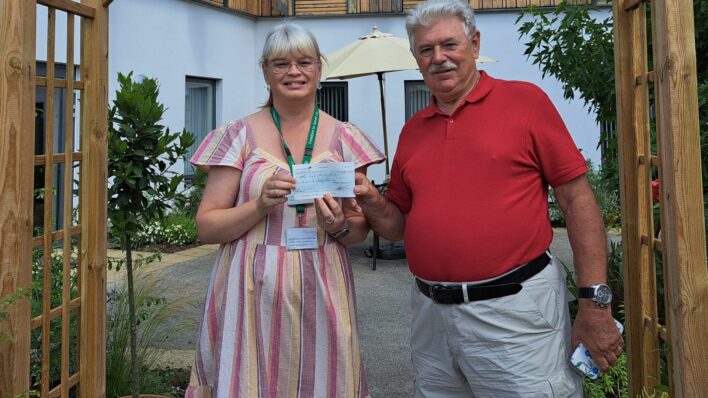 Tony Hore handing cheque to Alison Pinney