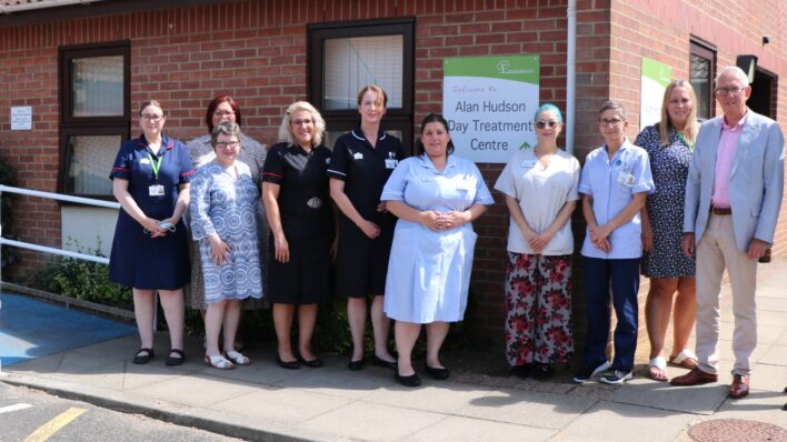 Nurses and men and women in a row outside the Alan Hudson Day Treatment Centre