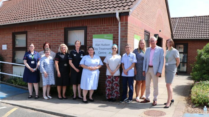 Nurses and men and women in a row outside the Alan Hudson Day Treatment Centre