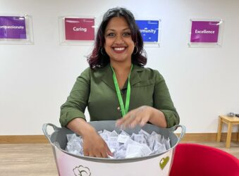 Fundraising team member drawing a raffle ticket