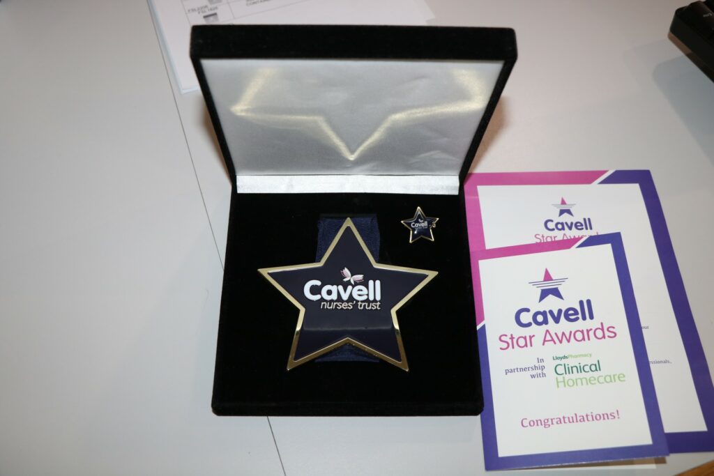 Black and white presentation box with star award and certificates