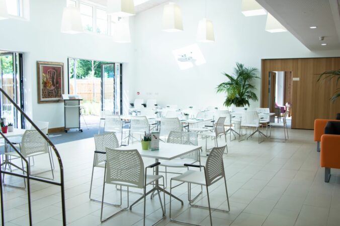 White table and chairs in a bright space
