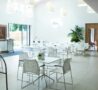 White table and chairs in a bright space