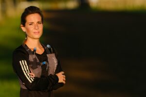 Female in running gear looking towards the camera 