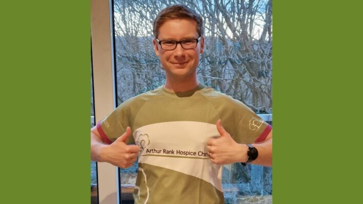 Man in glasses and Team Arthur Top with thumbs up