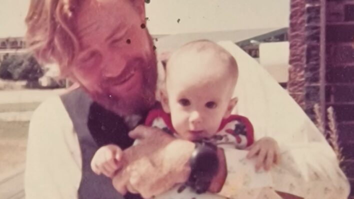 Male holding a baby