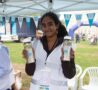 Female holding water bottles