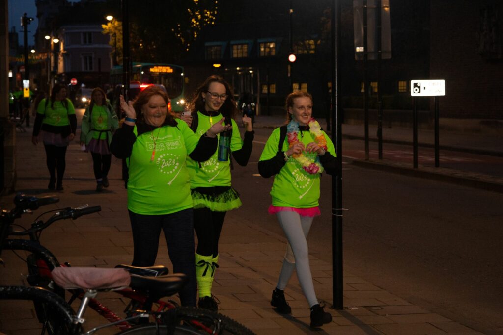 Females smiling walking in the night 