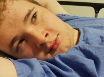 Teenage male lying down