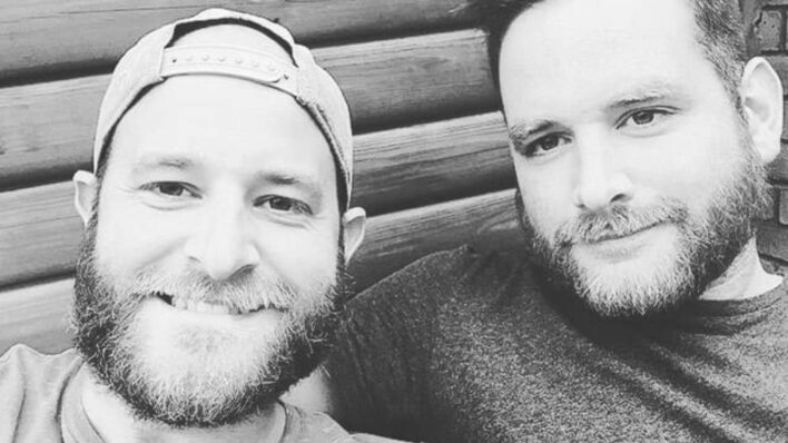 Black and white photo of two young men with beards