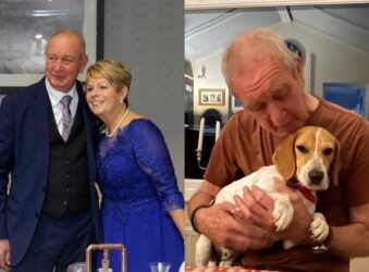 Man and lady in formal clothes and man holding dog.