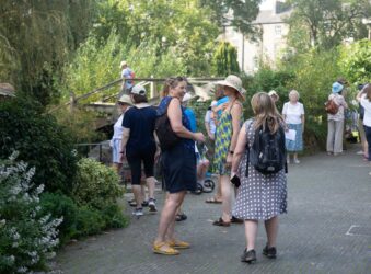 Females laughing together in a garden