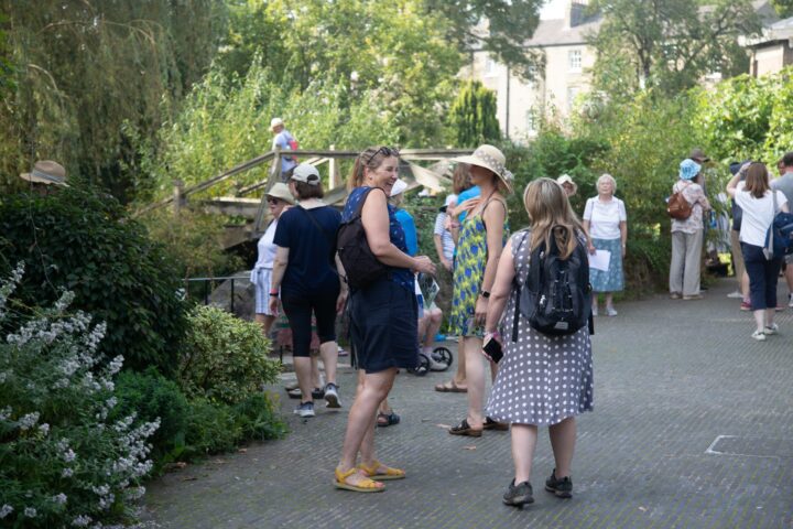 Females laughing together in a garden