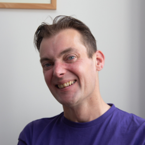 Headshot of a male smiling at the camera