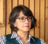 Female with glasses looking to the side