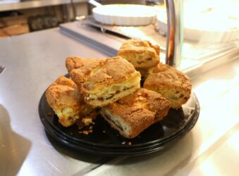 Pieces of apple cake on black tray