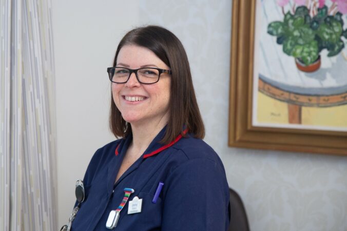 Female nurse smiling at the camera