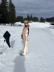 Female wearing ski wear on snowy slope