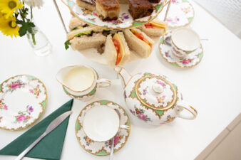 Tea pot, cups and sandwiches