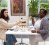 2 females sitting at a table with afternoon tea