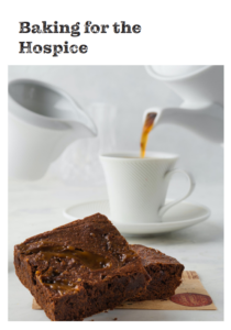 Photo of a chocolate brownie and white tea cup