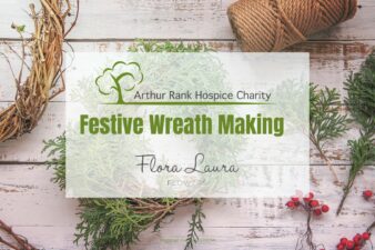 Festive wrath making and ARHC logo with background of string and berries.