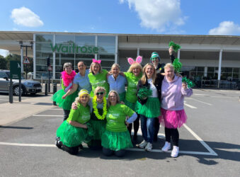 Group of females outside in a group wearing bright green