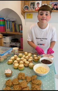 Young boy baking cakes