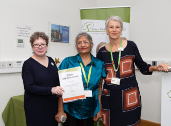 3 females holding a certificate