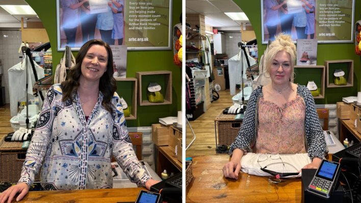 Two females behind a counter