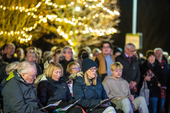 Group of people outside near lights