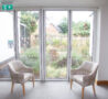 Full length windows, garden and chairs