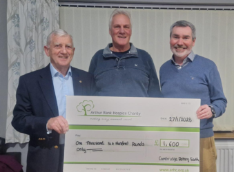 3 men holding a giant Arthur rank cheque