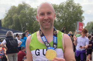 Male holding medal