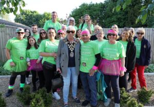 Male and females dressed in green