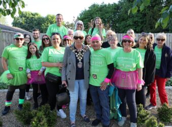 Male and females dressed in green