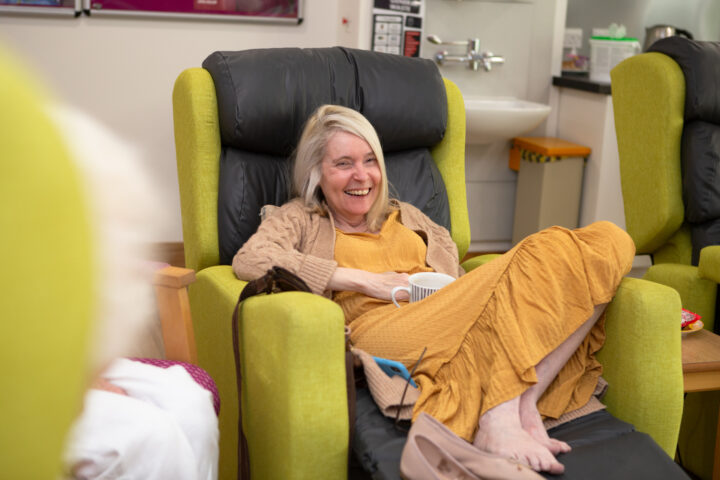 Female sitting in a chair laughing