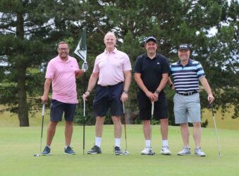 4 male golfers