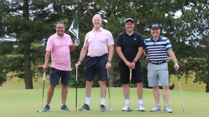4 male golfers