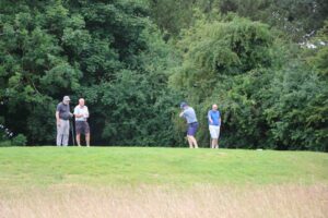 4 male golfers