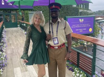 Lady and man under Wimbledon Umbrella