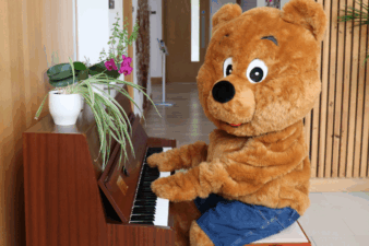 Arthur Bear sat playing the piano