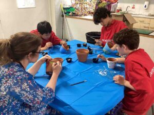 Adult and children painting 