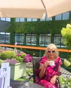 Female in a pink dress at Wimbledon Tennis Tournament