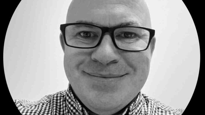 Male smiling at the camera - black and white