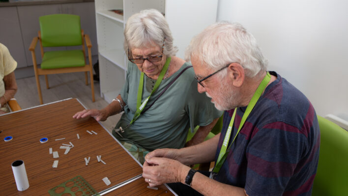 Male and female sitting at a table