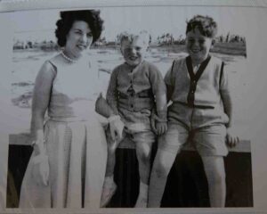 Black and white photo of a female with two children 