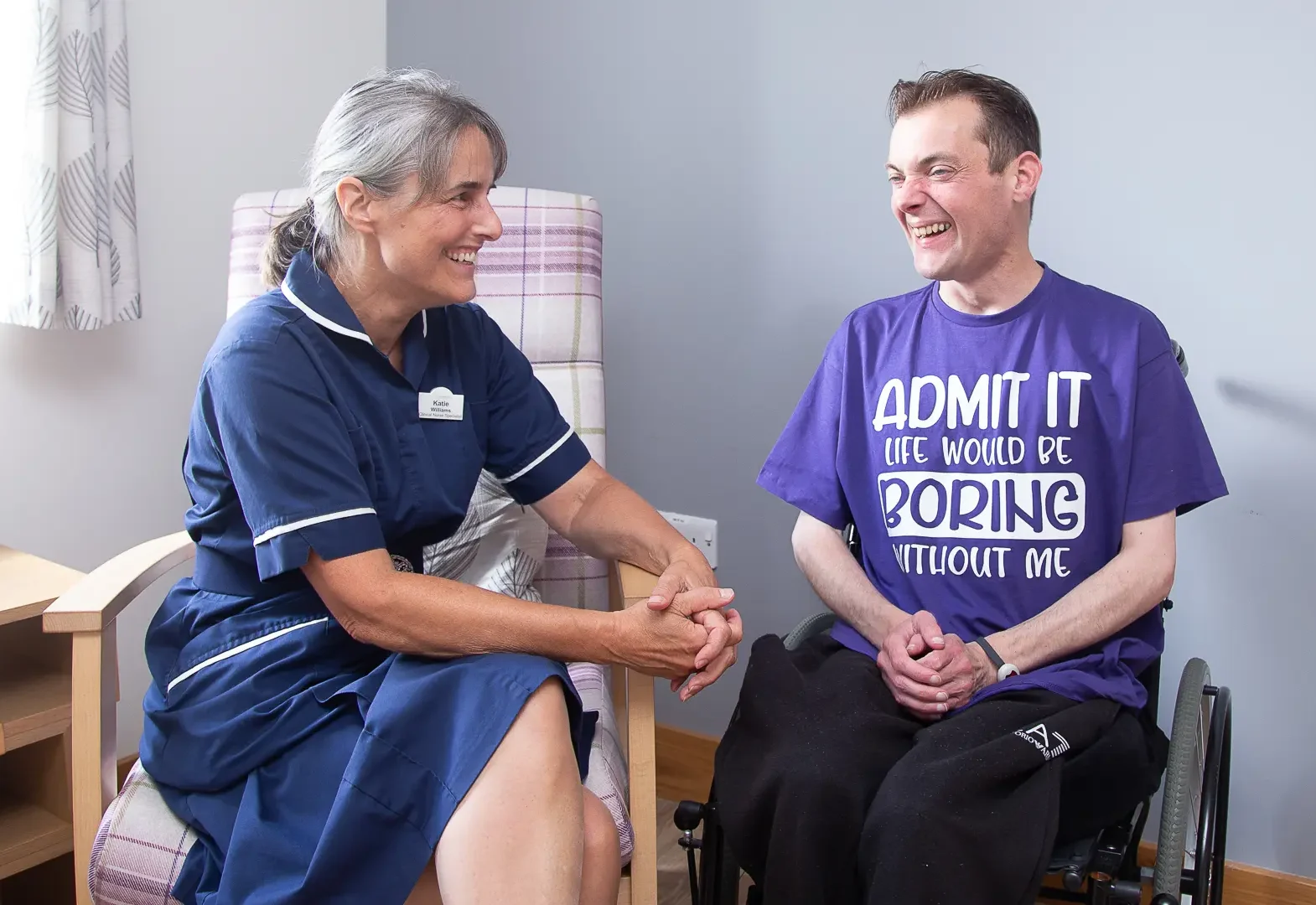 Nurse and male laughing together