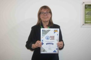 Female holding an award 