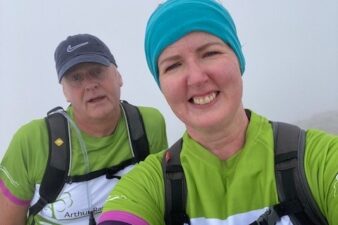 Male and female in green t-shirts
